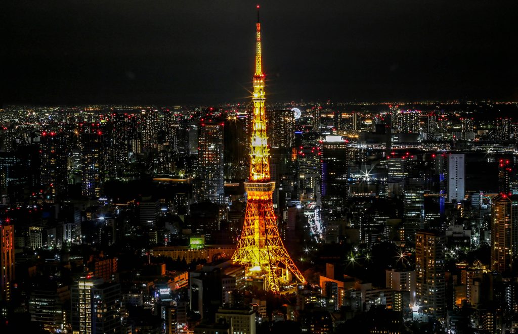 Tokyo Tower night view with city skyline — 2025 Tokyo budget hotel guide
